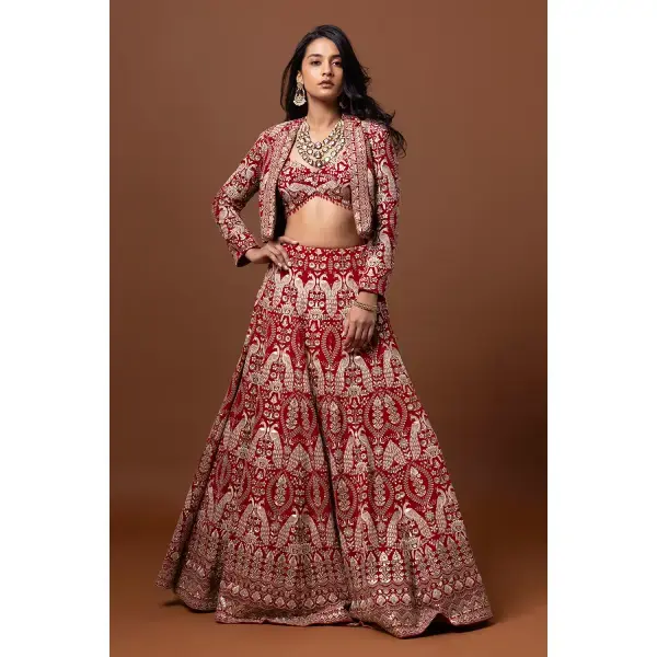 SEASONS-RED CLASSIC BRIDAL LEHENGA SET WITH ALL OVER PATTERNED THREAD WORK PAIRED WITH A MATCHING CROPPED JACKET AND SEQUIN DETAILS.